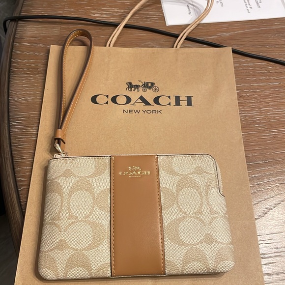 Coach Handbags - SALE PRICE FIRM NWT COACH WRISTLET - Sig PVC Light Cream Zip w/ Coach paper bag
